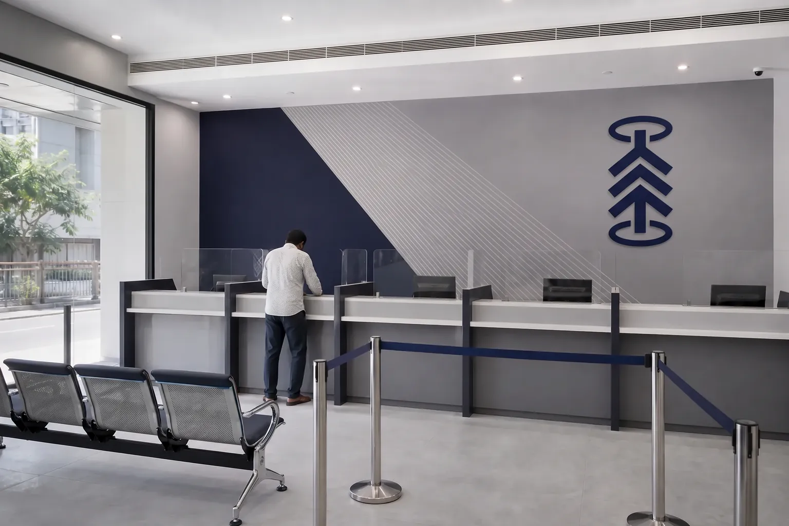 Bank branch interior with teller-counter graphics and a printed wall wrap