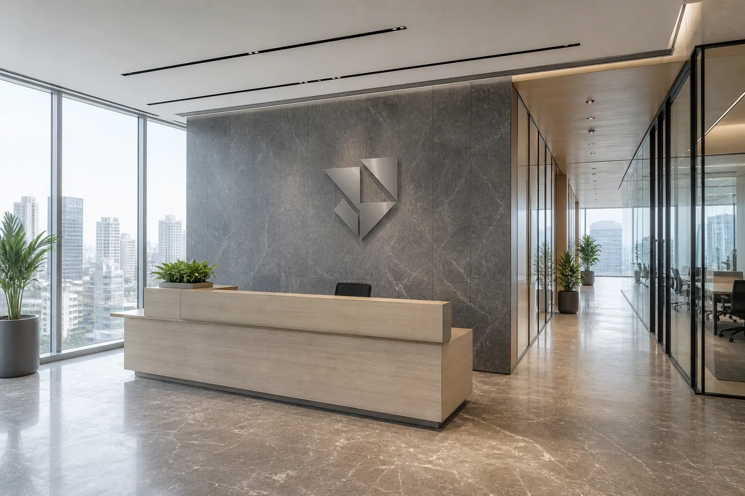 Reception of a completed office fit-out with a backlit logo wall behind a stone-clad welcome desk